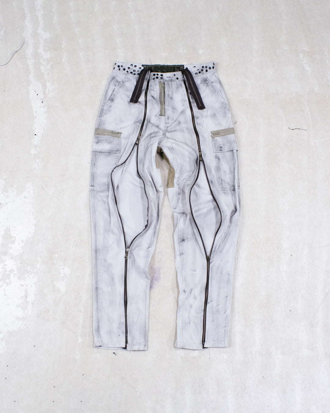 DISTRESSED ZIPPER TROUSERS