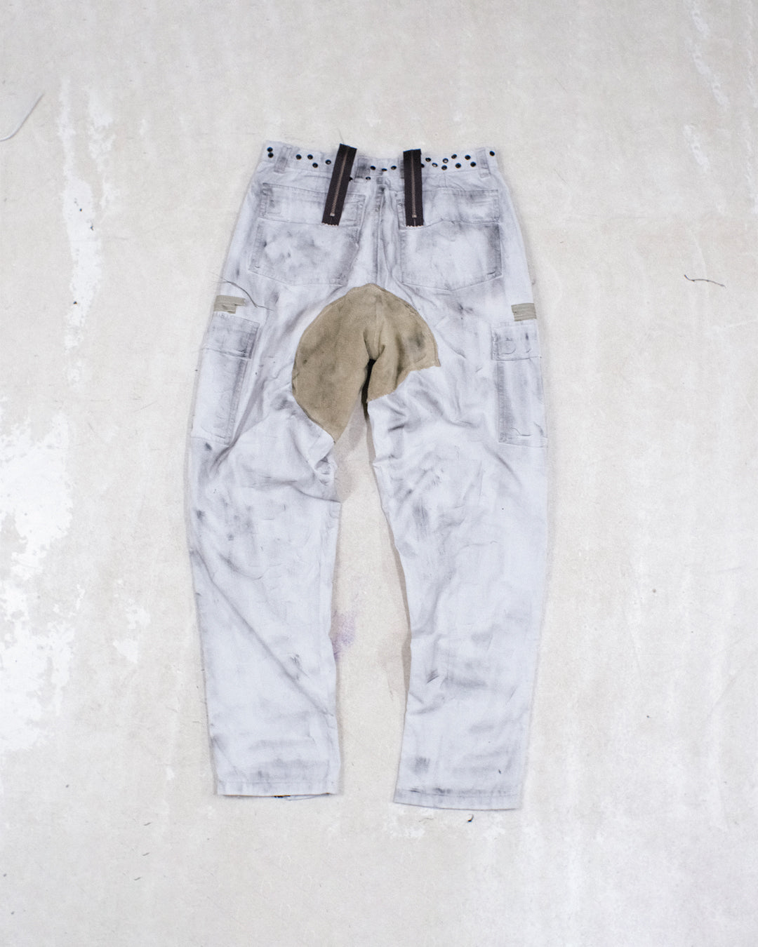 DISTRESSED ZIPPER TROUSERS